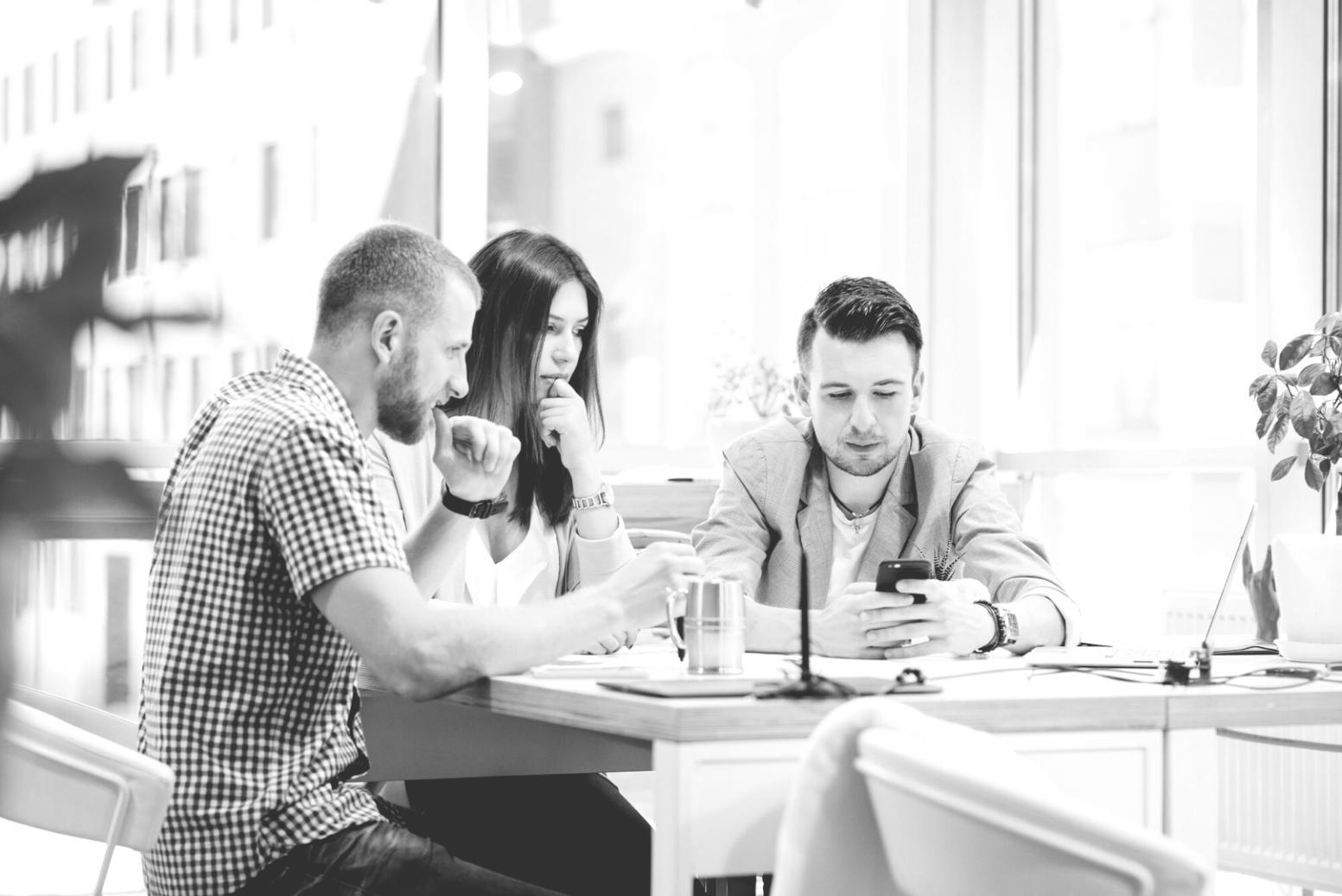Professional presenting budget data to engaged business audience